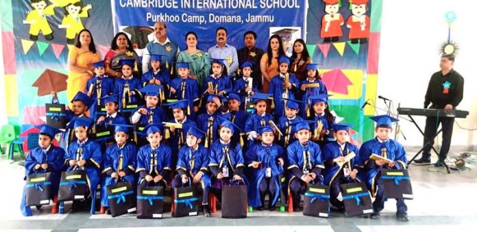 Dignitaries and School Management of CIS posing along with toddlers during a programme on Saturday.