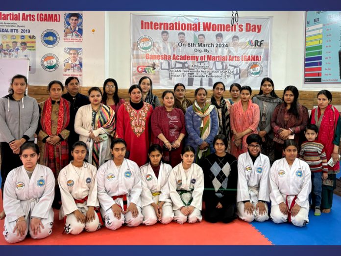 Martial arts athletes posing during a programme at Jammu. 