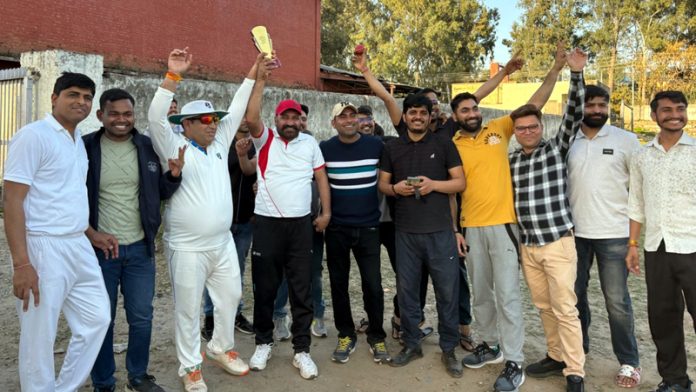 Commercial Department Railway team posing with trophy.