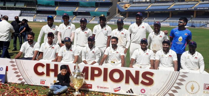 Winning team posing for a group photograph after clinching Ranji Trophy.