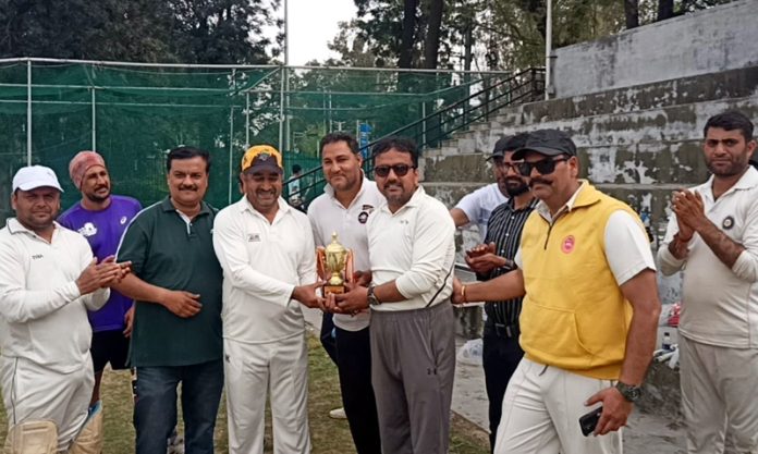 Winning team receiving trophy from chief guest during a match at Jammu University on Friday.