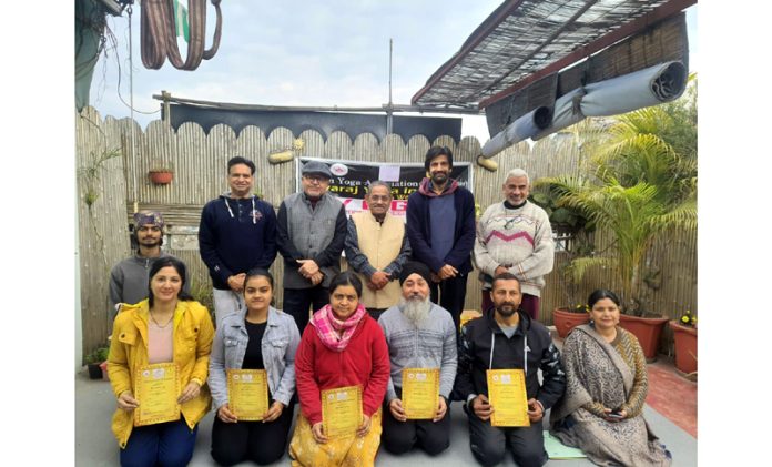 Dignitaries posing along with Yoga teachers at Jammu.