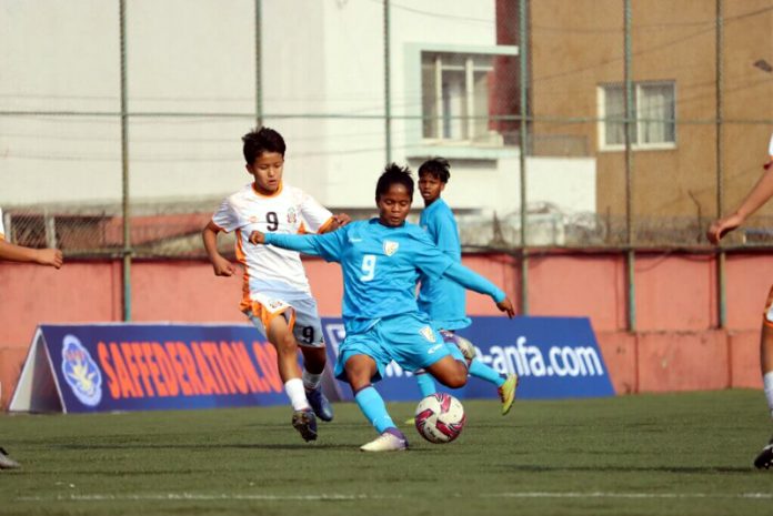 Players in action during a football match at Kathmandu on Friday.