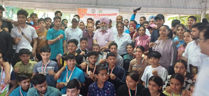 Boxers posing with medals along with dignitaries during concluding ceremony at Jammu on Sunday.