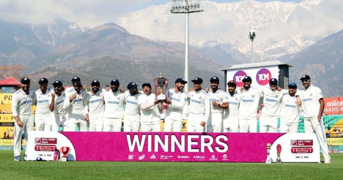 Indian Cricket Team posing with trophy after defeating England by 4-1 in Test Series at Dharamsala on Saturday.