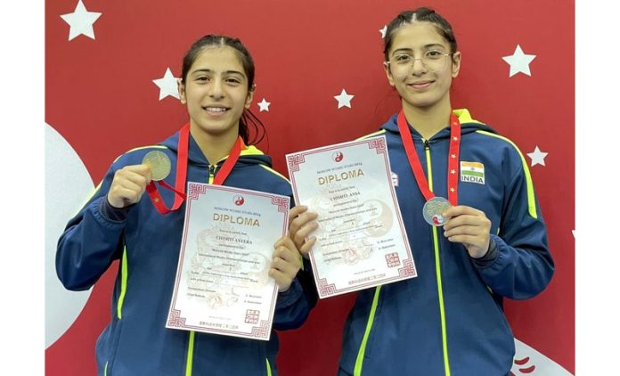 Wushu Sisters, Ansa Chishti and Ayeera Chishti Great posing with medals and certificates.