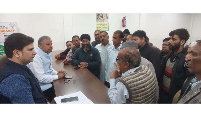 Senior BJP leader and former MLA listening public grievances at party office Jammu on Saturday.