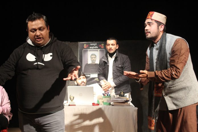 Artists performing in a play staged during Kullu National Theatre Festival on Wednesday.