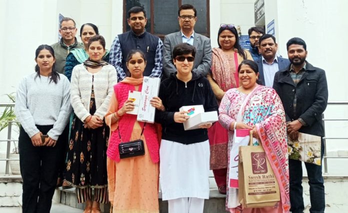 Visually impaired students and others at Govt College for Women Parade posing for group photograph after getting Smart Visual Aids.