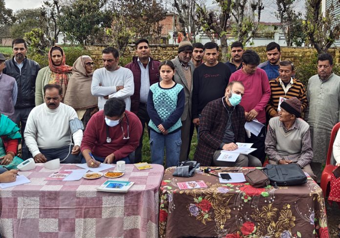 HoD Cardiology Dr Sushil Sharma examining patients at Tikri on Sunday.