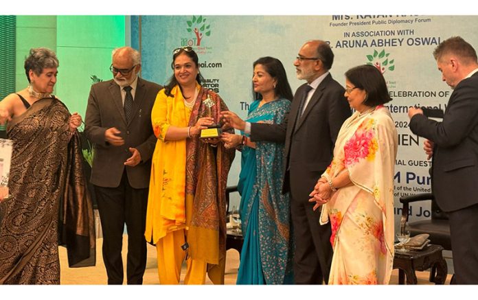 Varuna Anand receiving IWD award in New Delhi on Monday.