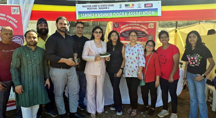 Dogra community people along with others posing for a group photograph during a food festival in Uganda.