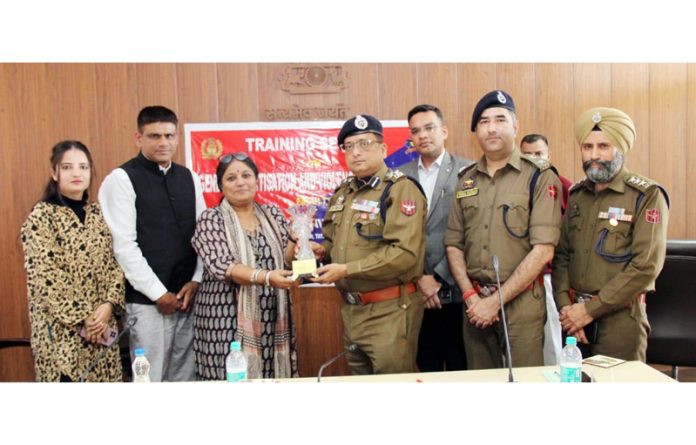Dr Sunil Gupta, DIG JSK Range, presenting a souvenir to a dignitary during a training session for women police officers in Jammu on Monday.