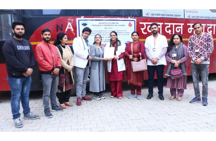 Medical team with organizers of blood donation camp at CUJ.