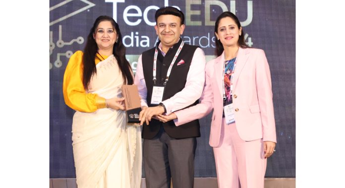 Prof Ankur Gupta (Director MIET) and Ruchika Gupta (Joint Director) receiving award at Edutech Summit in Mumbai.