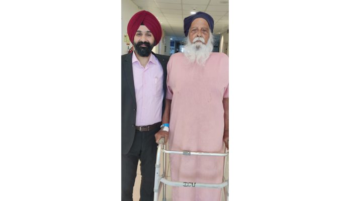 Dr Ranjit Singh posing with a patient after performing knee replacement procedure.