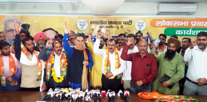 BJP president, Ravinder Raina taking new entrants into party fold at BJP Headquarters, Trikuta Nagar on Friday