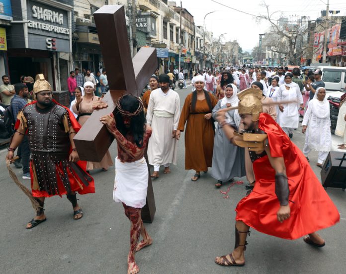 Members of Christian community taking out a procession in Jammu on eve of Good Friday and Easter on Wednesday. -Excelsior / Rakesh