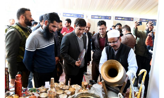 Div Com V.K. Bidhuri alongwith Mahmood Shah during visit to exhibition at Kashmir Haat on Satruday. -Excelsior/Shakeel