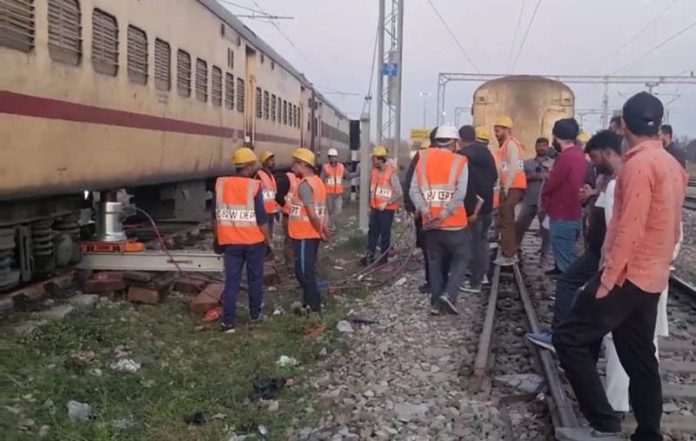 Railway ground staff clearing track at Railway Station Vijaypur on Friday evening.