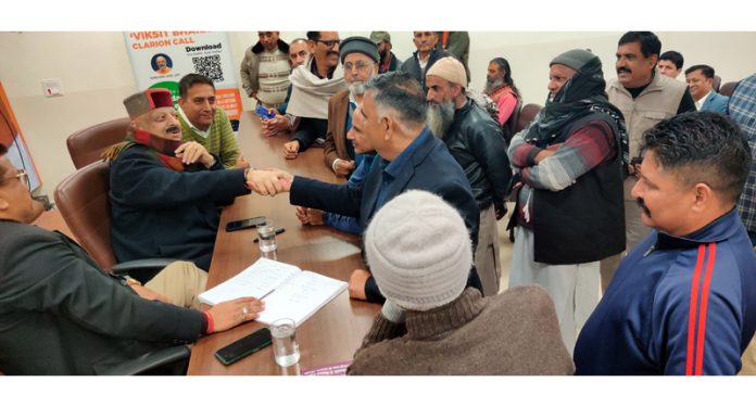 Sr BJP leader Devender Singh Rana listening public grievances at BJP Headquarters on Friday.