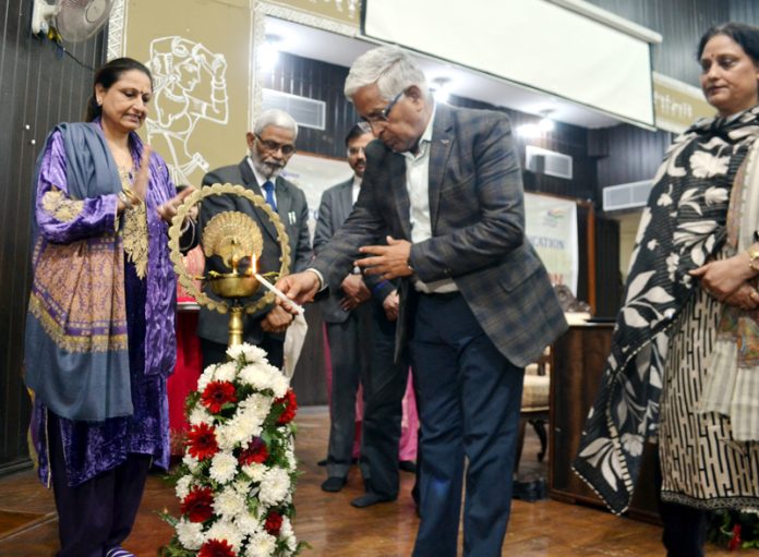 JU Vice-Chancellor lighting ceremonial lamp during a programme in connection with Foundation day of DD&OE.