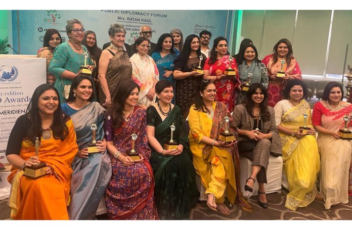 Dr Ritu Singh and other women achievers posing with their awards at a function in New Delhi.