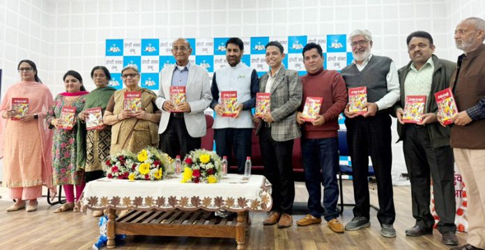 Members of Dogri Sanstha Jammu and others releasing Pawan Verma's collection of poems.