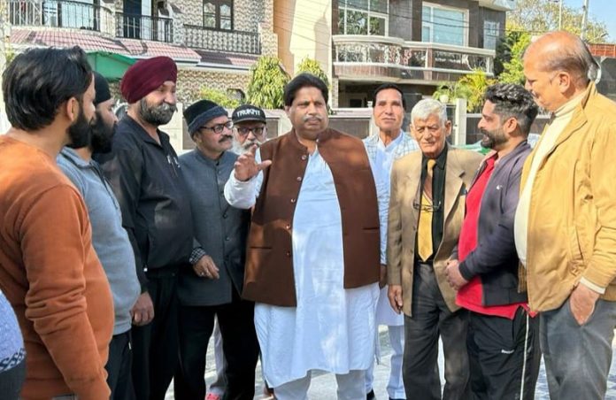 JKPCC working president Raman Bhalla interacting with people in Jammu on Sunday.