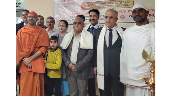 Guests and doctors posing with officials of Ramakrishna Mission Jammu during a neurology camp at Udheywala, Jammu.