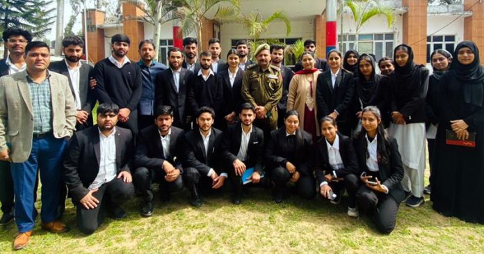 Students of The Law School of JU posing with SHO PS Gandhi Nagar Inspector Sudhir Sadhotra.