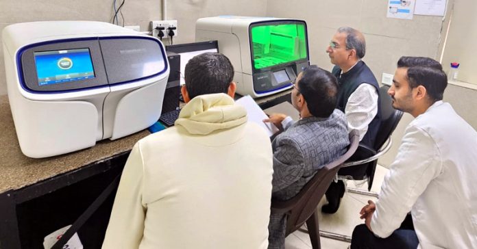 HoD Microbiology in GMC Jammu, Dr Sandeep Dogra and his subordinates doing cancer genetic testing on NGS equipment.