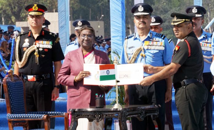 -President Droupadi Murmu releasing a commemorative Postage stamp during the presentation of President's Standard and President's Colours to four units of the IAF at Hindan Air Force station in Ghaziabad on Friday. (UNI)