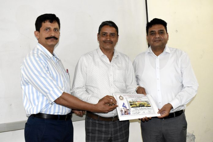 Dignitaries posing for a photograph on culmination of a training programme at S.K Police Academy Udhampur.