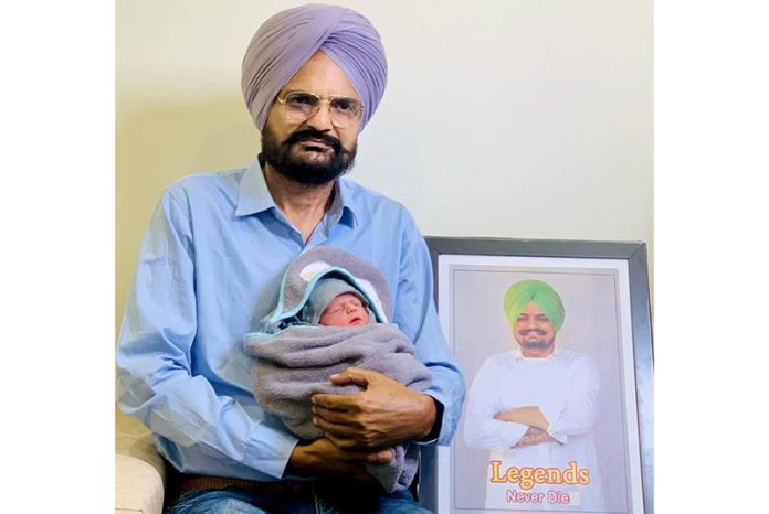 Sidhu Moosewala's father Balkaur Singh with the newborn.