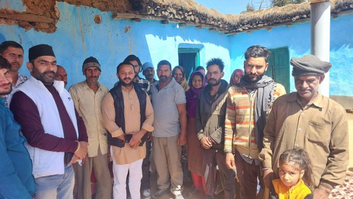 Congress leader Sumeet Magotra meeting with people during tour to Udhampur villages.