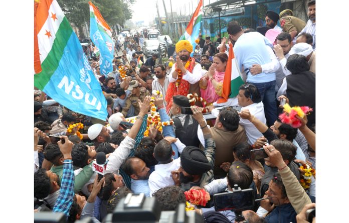 Ex-MP Ch. Lal Singh being received by Cong workers and his supporters outside Jammu airport on Thursday. -Excelsior/Rakesh