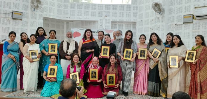 Women achievers of J&K who were honoured by Vomedh the renowned theatre group at Jammu on Thursday posing for a photograph.