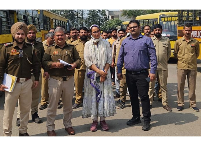 RTO Jammu Pankaj Bhagotra, ARTO HQ Rehana Tabassum and others during safety audit of buses at KC Public School, Jammu.