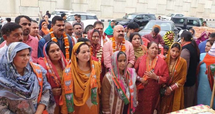 The new entrants who joined BJP posing for a photograph with senior party leaders including Yudhvir Sethi and Parmod Kapahi at Jammu on Sunday.