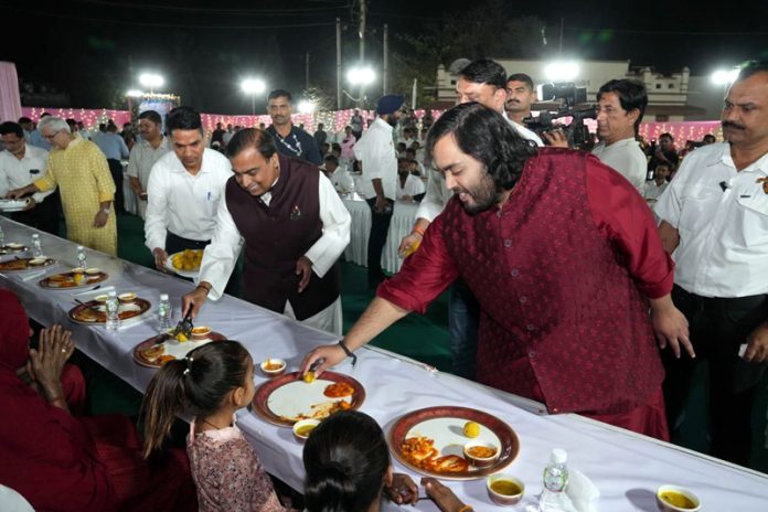 The family members of Ambani serving food to people on occasion of the pre-wedding celebrations of Anant and Radhika on Thursday.