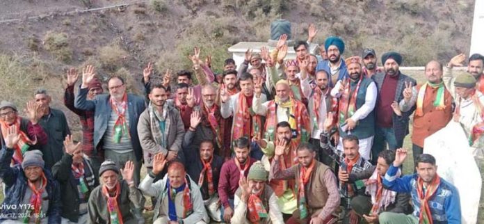 BJP Minority Morcha’s J&K president Ranjodh Singh Nalwa posing with new entrants of the party at Lohai Malhar in Kathua district.