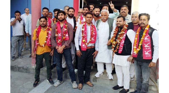Additional general secretary of NC, Ajay Sadhotra posing with newly appointed office bearers of Bhalwal Block of Jammu district.