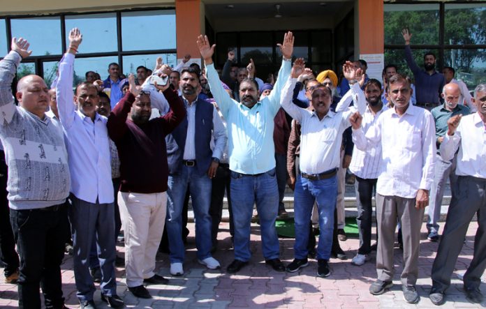PHE employees staging protest outside Chief Engg’s office in Jammu on Wednesday.