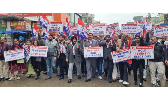 Apni Party activists staging protest at Vijaypur in Samba on Friday.