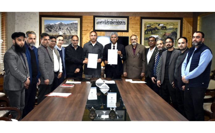 Director IIM Jammu and Vice-Chancellor of SKUAST Kashmir displaying copies of MoU signed between the two institutions.