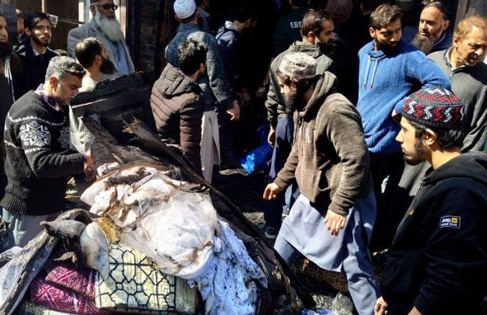 Damaged goods in a blaze that raged Bohri Kadal area of Srinagar on Friday. -Excelsior/Shakeel