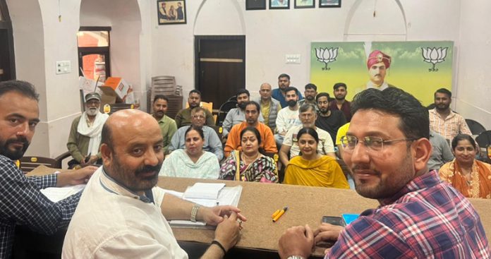 Senior BJP leader and former Minister Bali Bhagat addressing during a party workers meet in Jammu on Saturday.