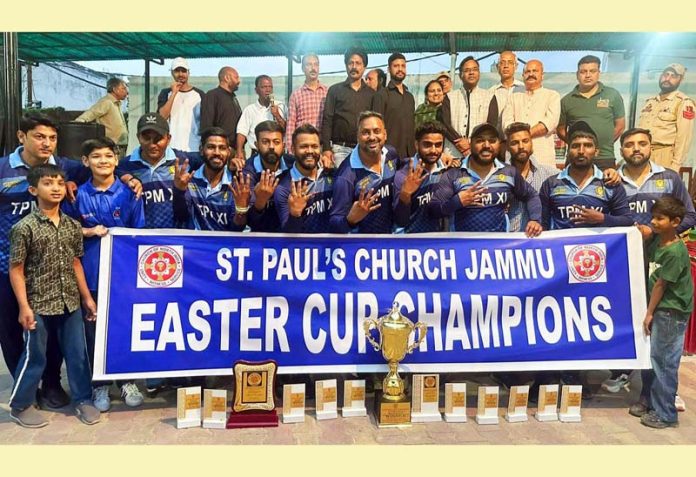 Winning team posing along with dignitaries during a cricket tournament at Jammu.