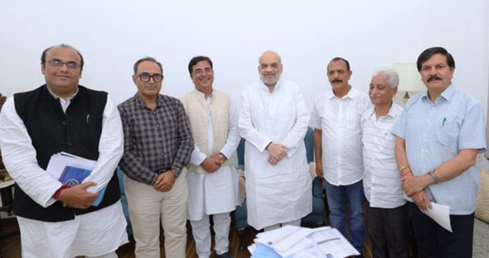 Delegation of Kashmiri migrants with Home Minister Amit Shah during a meeting at Delhi on Monday.